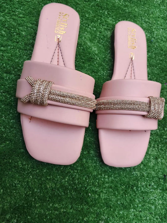 Pink women's flat sandals front view with stylish strap design
