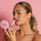 Woman applying 4 in 1 multi-effect makeup pen for precise eyeliner and eye makeup.