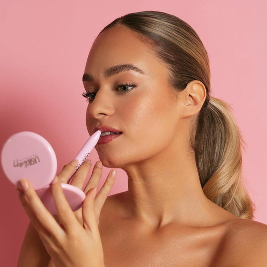 Woman applying 4 in 1 multi-effect makeup pen for precise eyeliner and eye makeup.