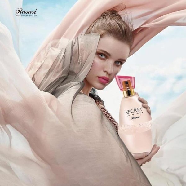 Elegant woman holding Secret Rasasi Eau De Parfum 75ML