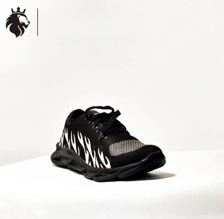Side view of boys athletic running shoes with non-slip sole