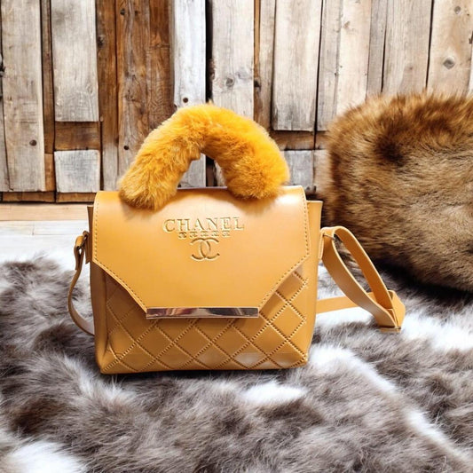 Luxury quilted handbag with faux fur handle for women featuring elegant designer-inspired crossbody style.