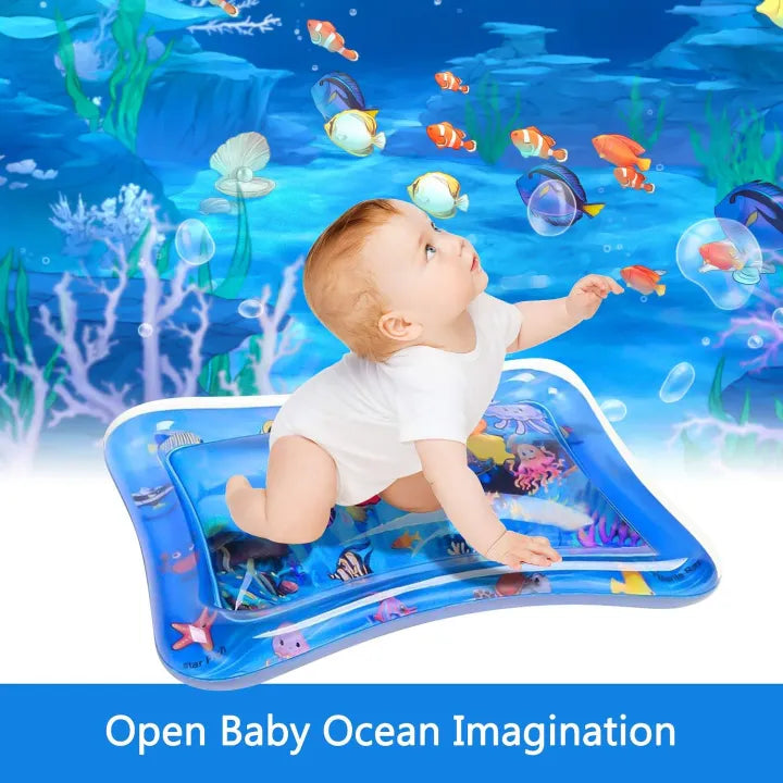 Baby playing on a colorful ocean-themed water play mat during tummy time and sensory play