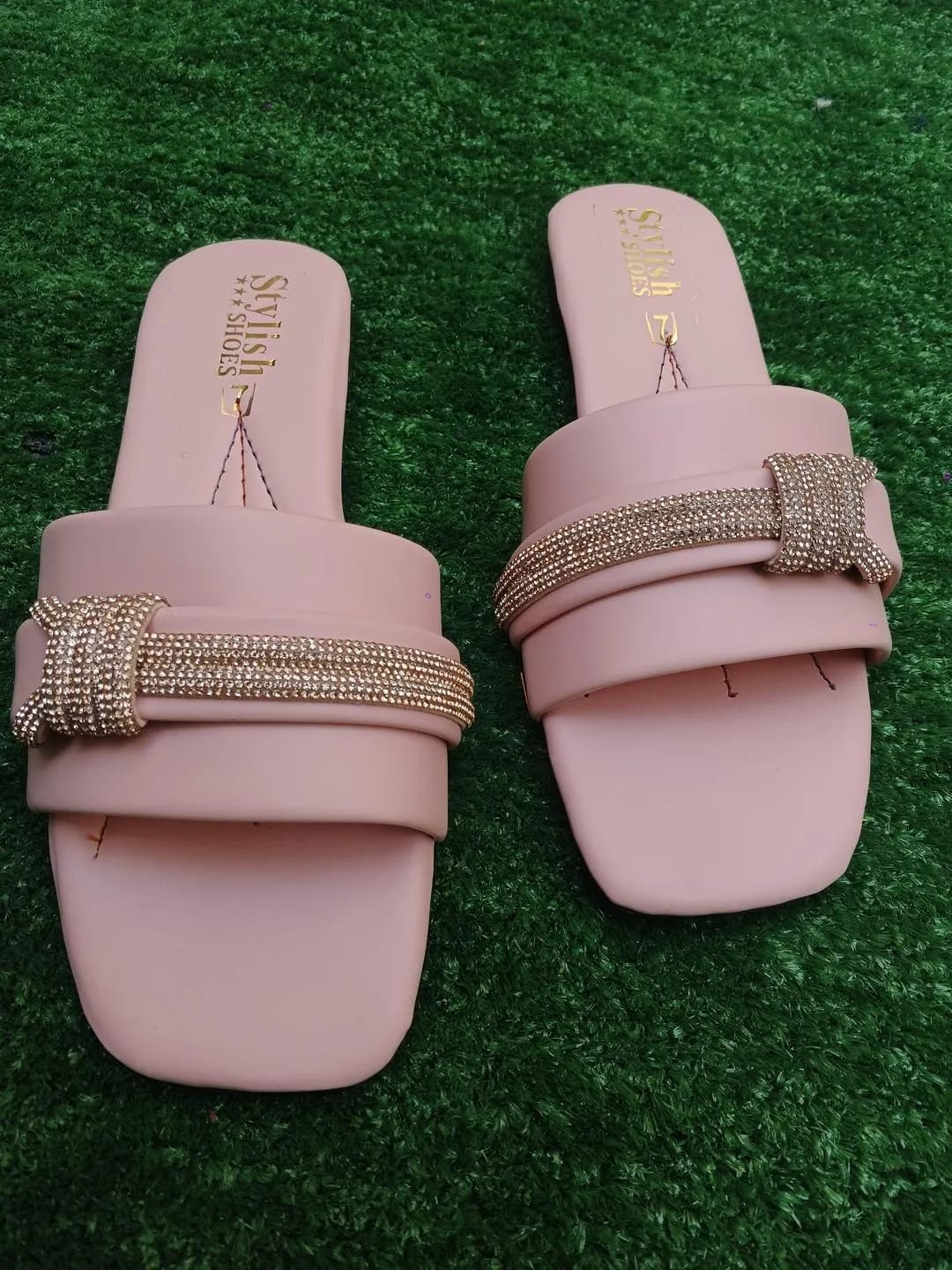 Pink women's flat sandals side view with comfortable flat sole
