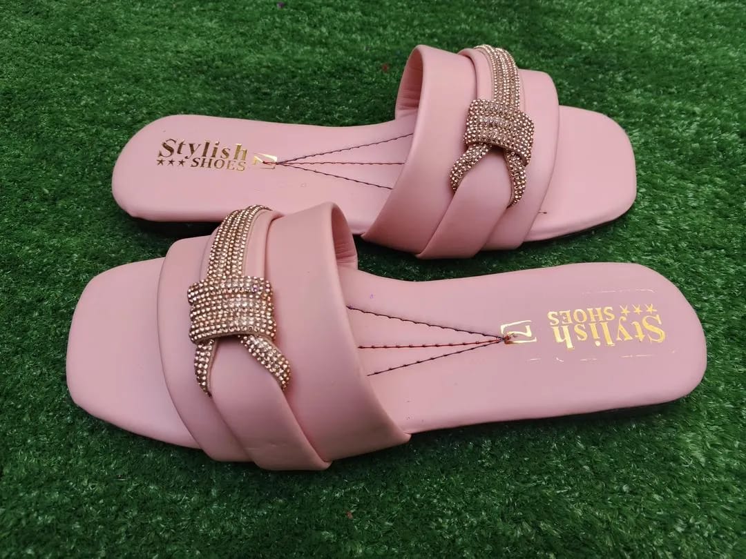 Pink women's flat sandals with stylish buckle design and comfortable sole