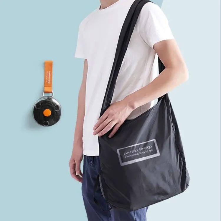 Foldable reusable shopping tote bag carried on shoulder random color