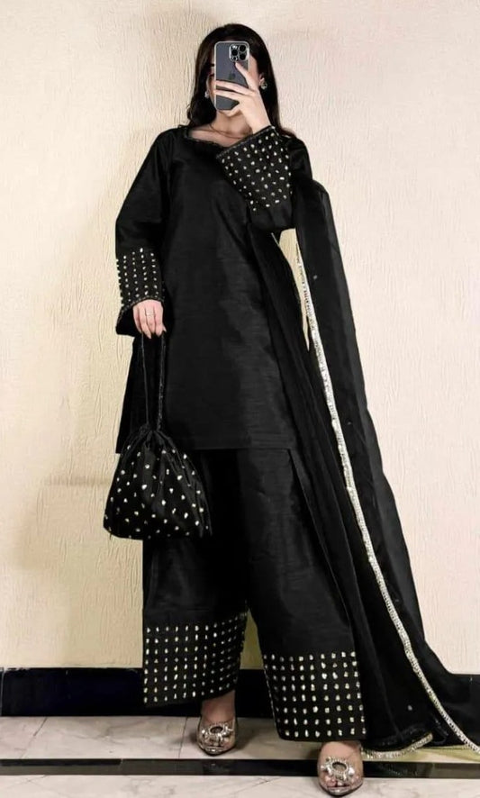 Women's black salwar kameez suit set with matching dupatta and traditional design